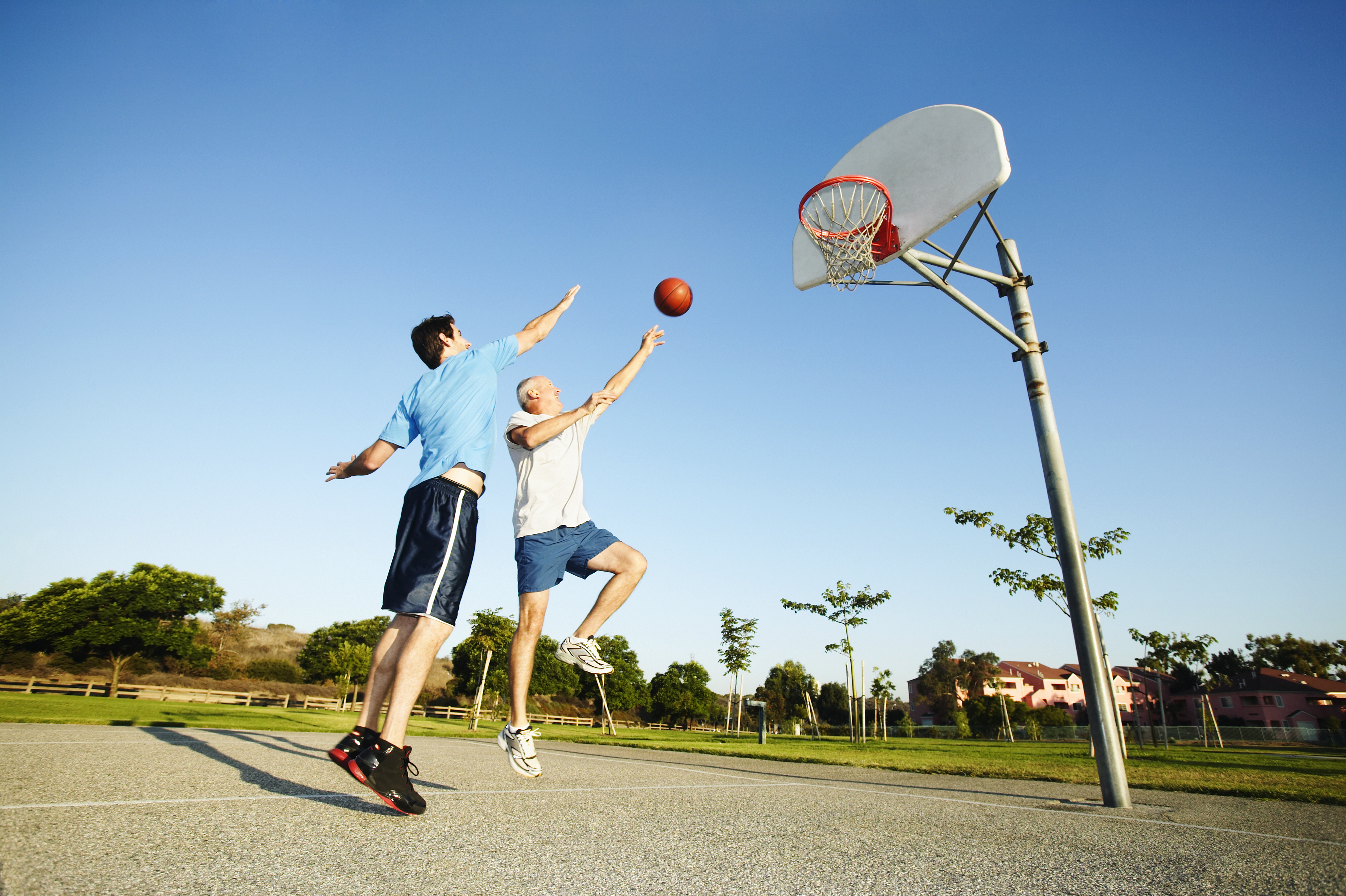 Two people are in a basketball court