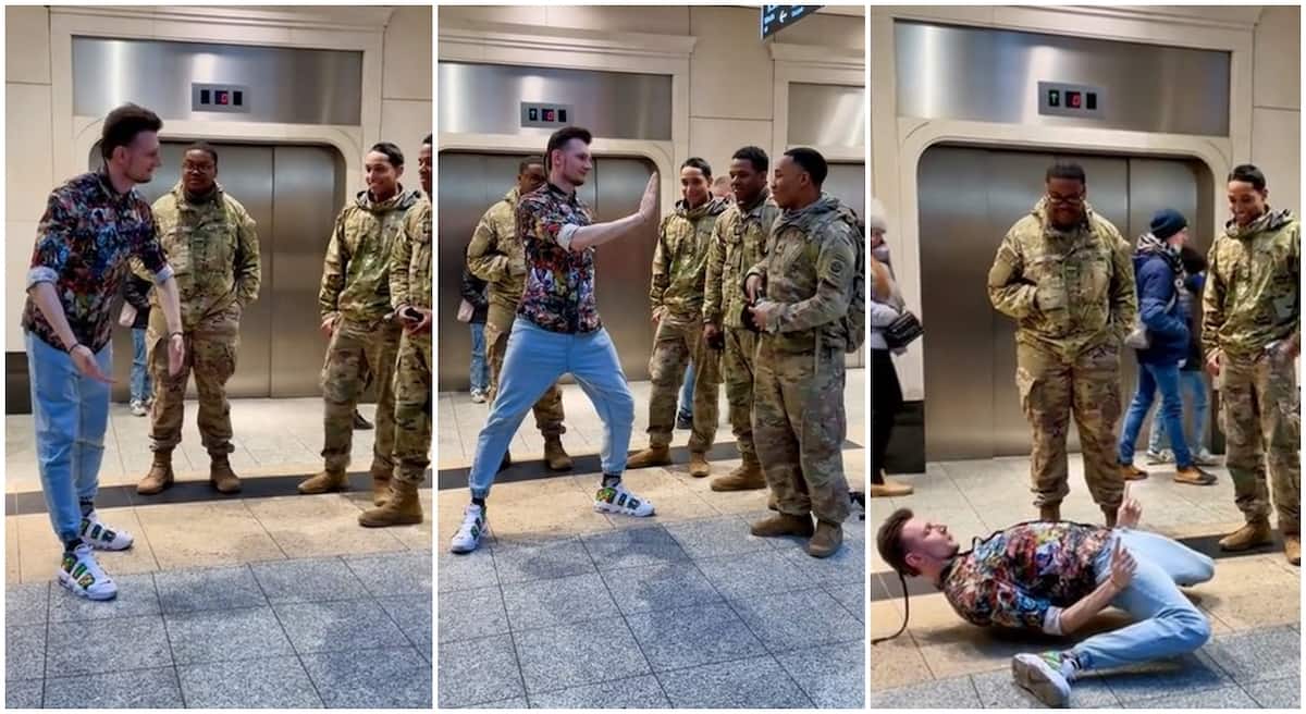 Man dances for American soldiers in Poland, twists his body like Michael Jackson.