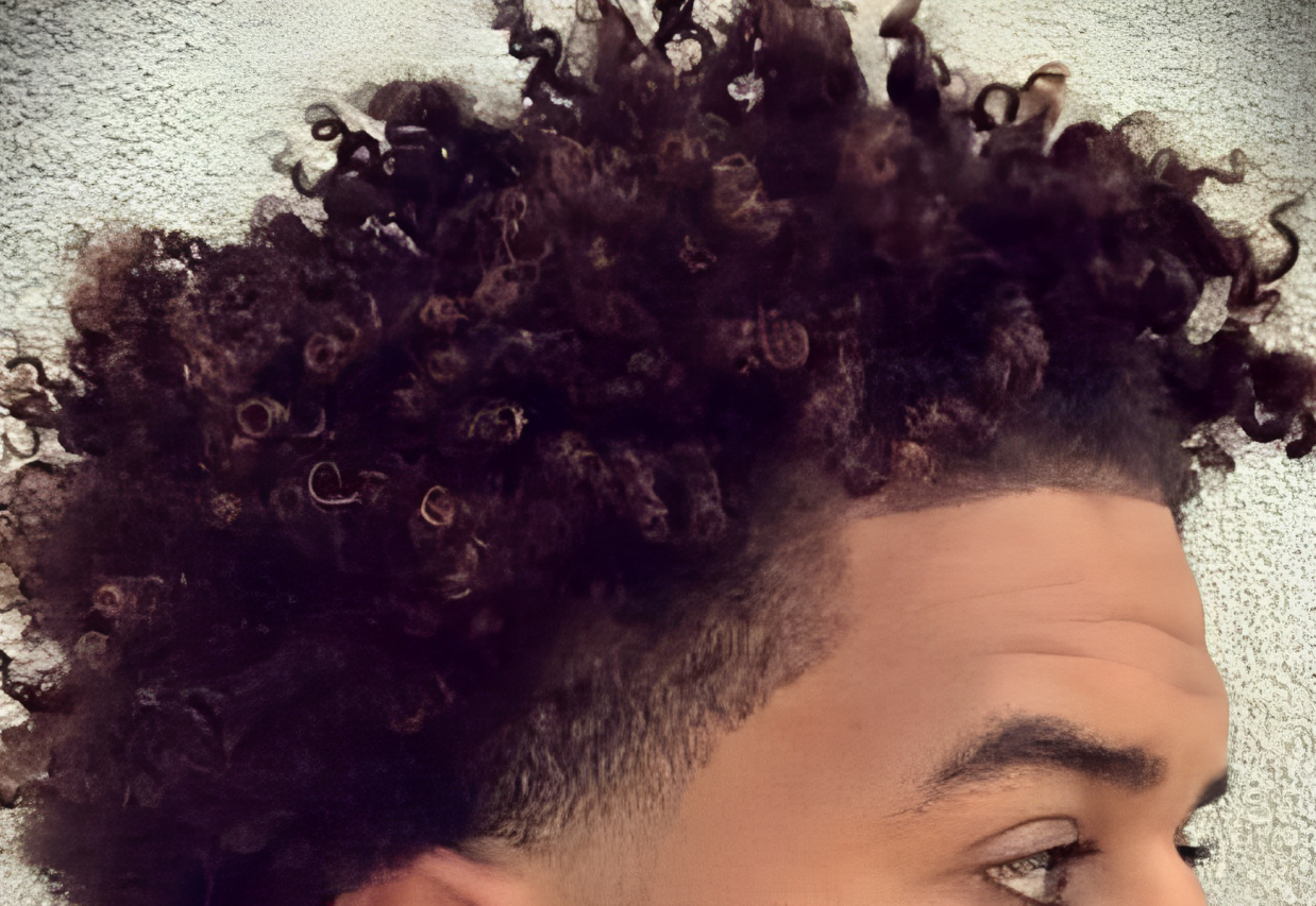 An African-American man with a medium textured haircut