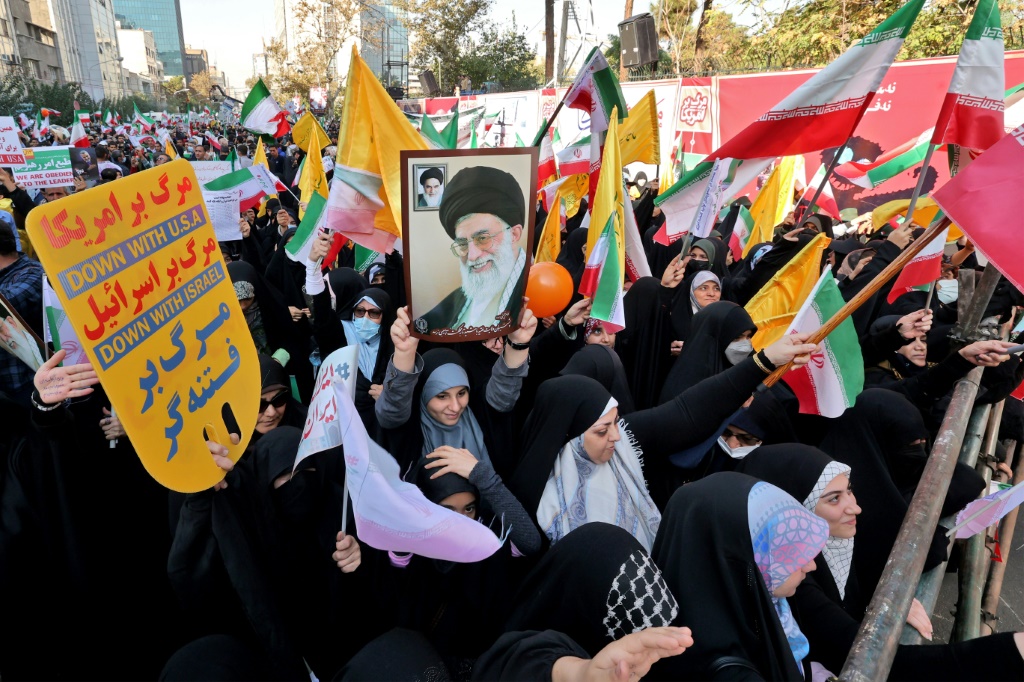 Pro-government protesters gather outside the former US embassy in Tehran
