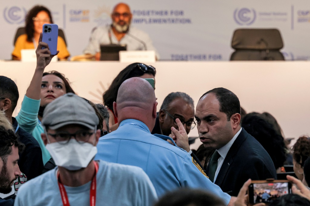 Egyptian MP Amr Darwish is escorted out by United Nations security during a press conference hosted by the Global Campaign to Demand Climate Justice and attended by Sanaa Seif, sister of imprisoned British-Egyptian activist Alaa Abdel Fattah