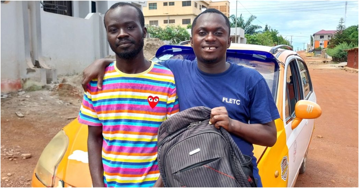 Photo of taxi driver and man who items were returned to him