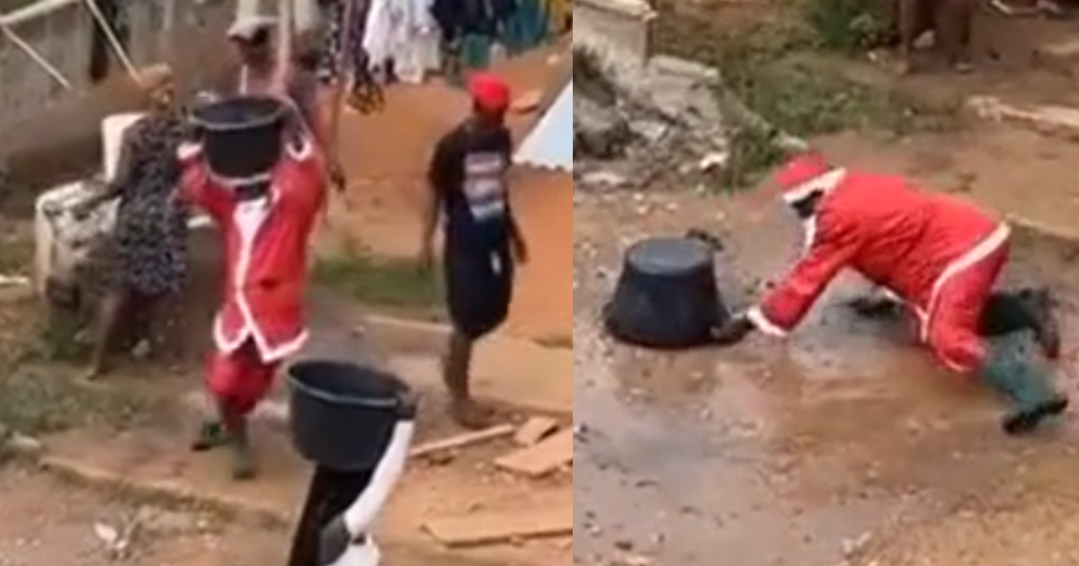 Santa Claus falls on the ground after fetching water