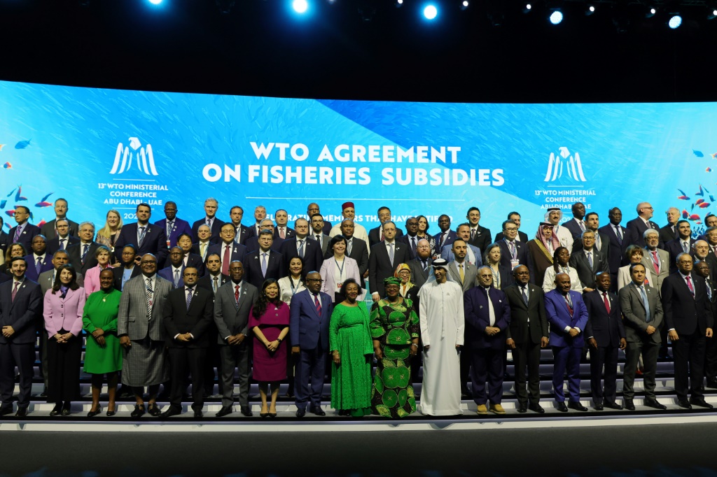 Delegates take a group picture during a session on fisheries subsidies during the 13th WTO Ministerial Conference in Abu Dhabi of February 26, 2024. The world's trade ministers gathered in the UAE on February 26 for a high-level WTO meeting with no clear prospects for breakthroughs, amid geopolitical tensions and disagreements.