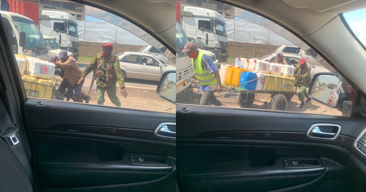 Kind police officer pictured helping water vendor push his mkokoteni