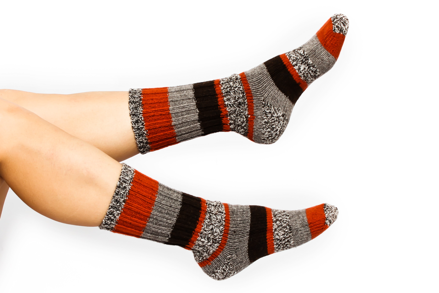 A woman with grey, black, and red crew socks