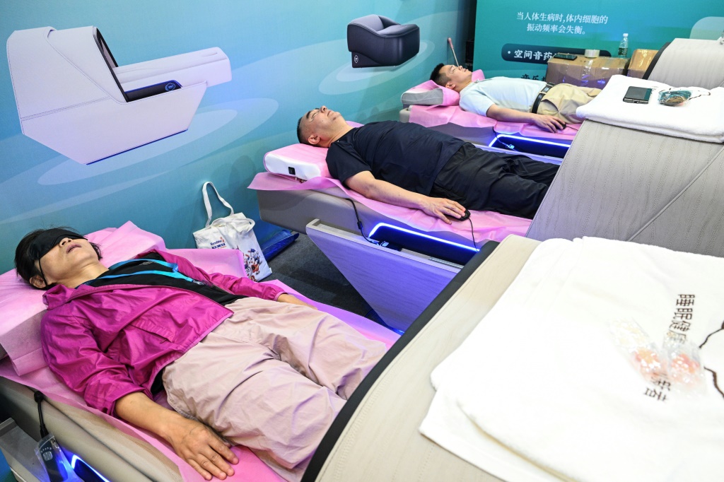 Internet-connected sleep monitors, robotic arms and calorie-counting cafeteria plates were on display at an elder care industry fair in Shanghai