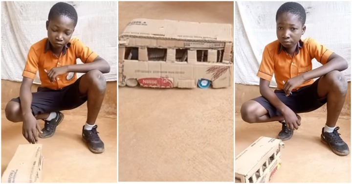 Ghanaian boy builds car with carton.
