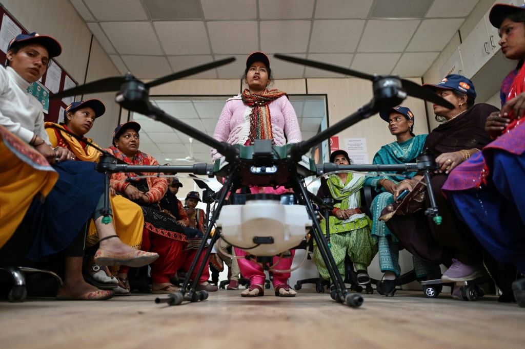 Aspiring drone pilots attend a class under the Indian government-backed "Drone Sister" programme