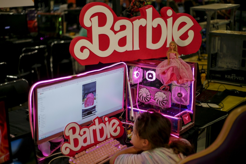 A child looks at a Barbie-themed computer in Anhembi, northern Sao Paulo, Brazil, on July 26, 2023