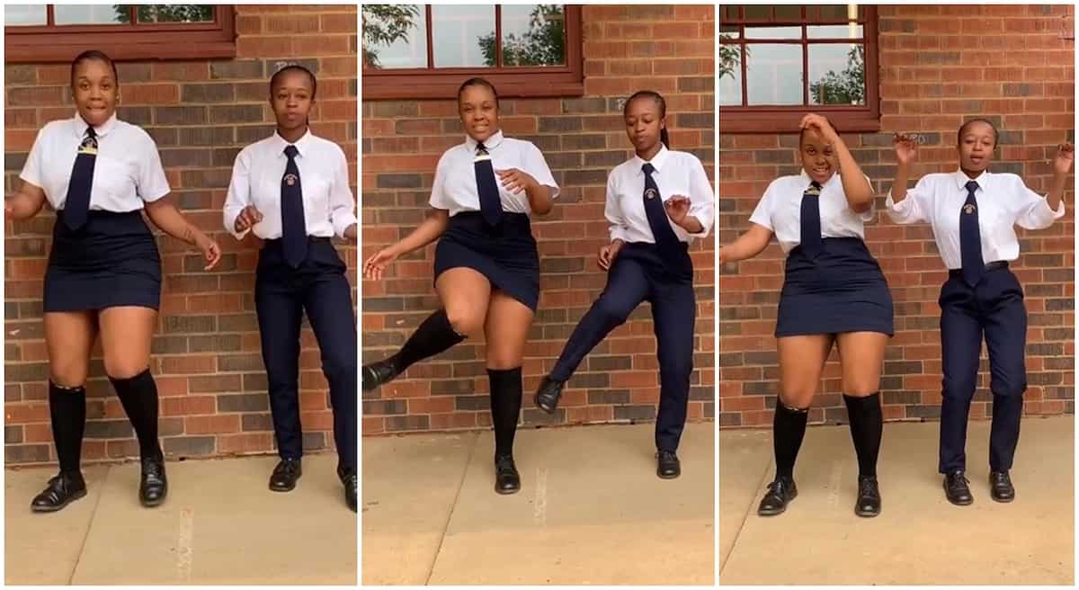 Two female students in school uniform dance outside classroom, video of accurate steps goes viral