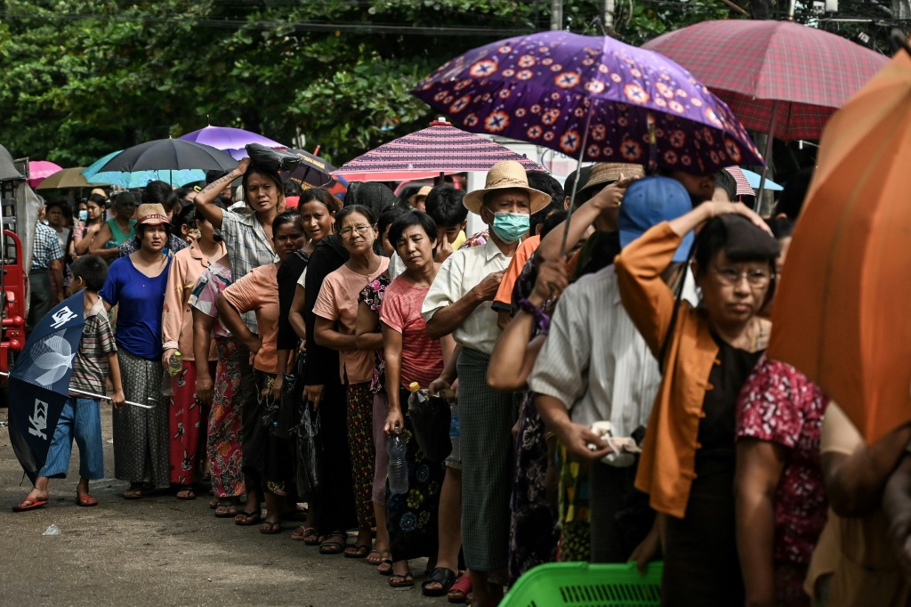 Queues for basic commodities have sprung up in Myanmar's commercial capital