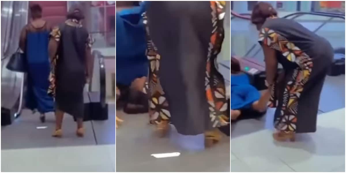 Woman falling from escalator