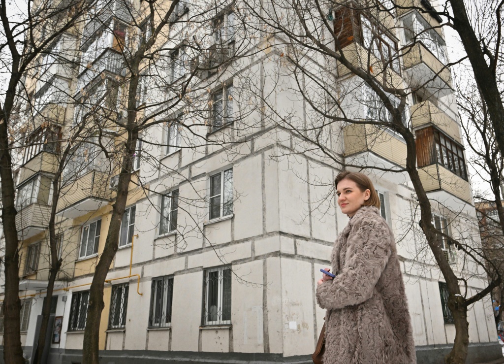 Estate agent Anastasia Chichikina heads to an apartment for sale in Moscow where property prices have dipped significantly since Russia's military action in Ukraine