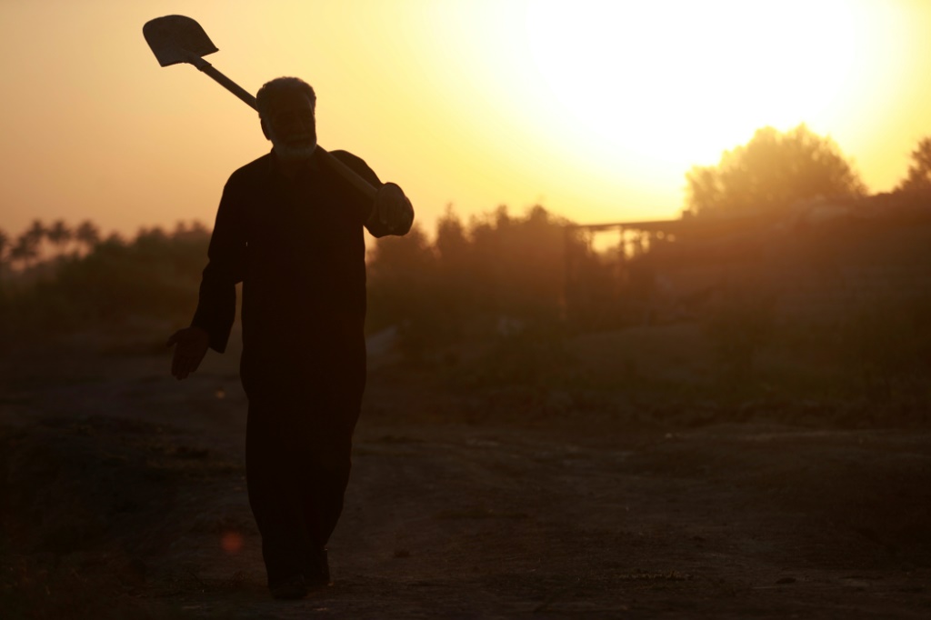 A farmer on the outskirts of the central Iraqi city of Hilla as temperatures soared past 45 degrees Celsius
