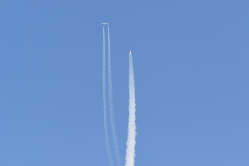 The Virgin Galactic SpaceShipTwo space plane Unity and mothership separate as they fly way above Spaceport America in New Mexico on July 11, 2021