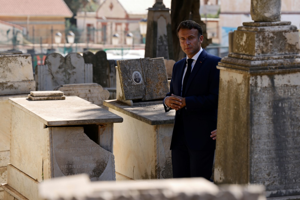 French President Emmanuel Macron visits the European Saint-Eugene Cemetery in Algiers on August 26, 2022, the second day of his visit to the former colony