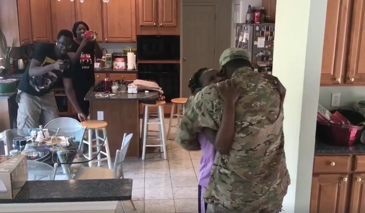 Nigerian soldier surprises his mother with early return home after one year in US military (photos)